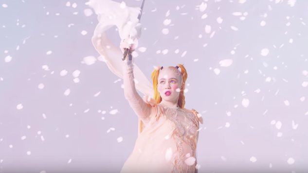 Watch Grimes’ New “Idoru” Video, Complete with Aggressive Pastels and Anime